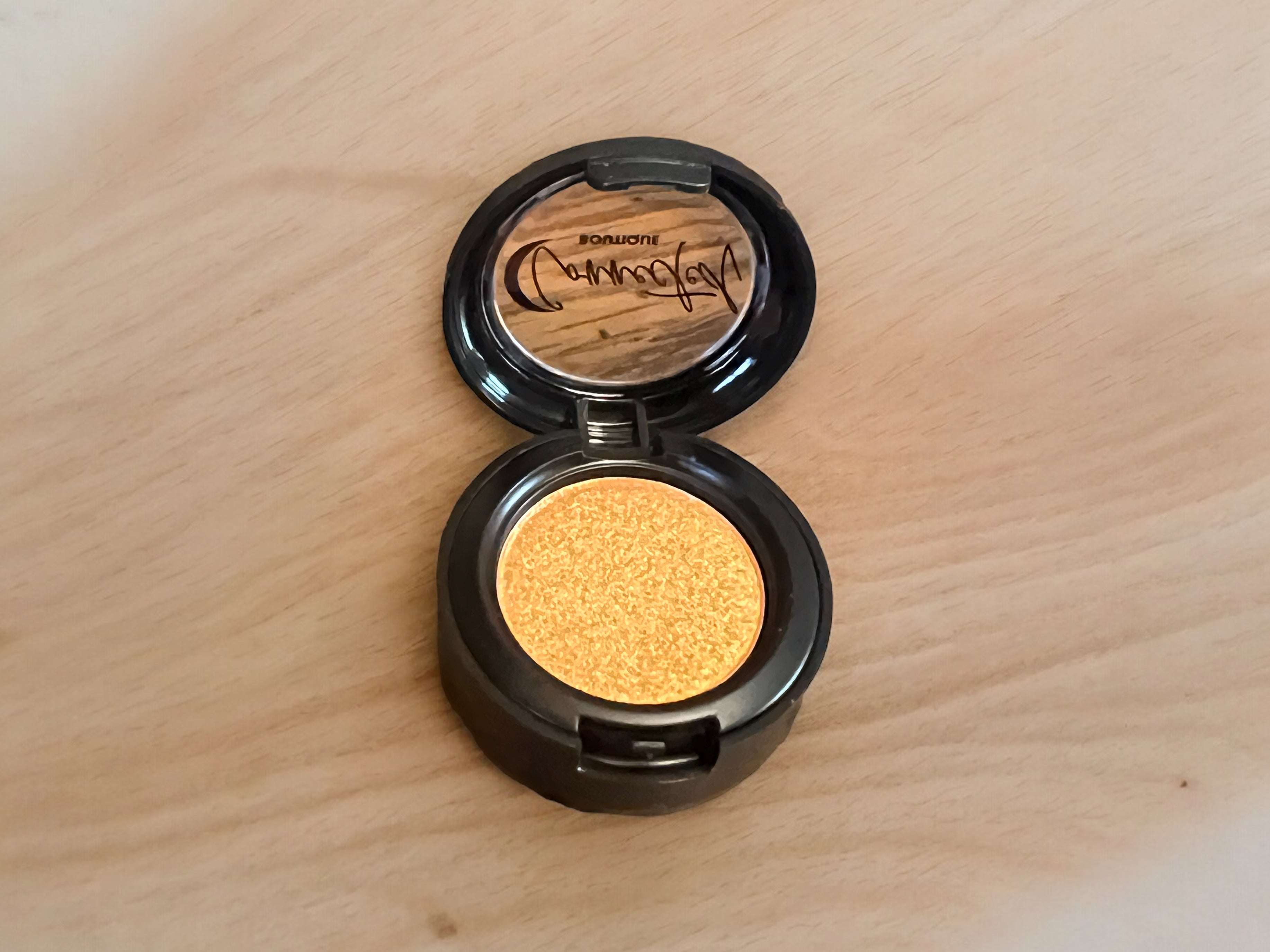 Astral Kiss orange shimmer single eyeshadow
